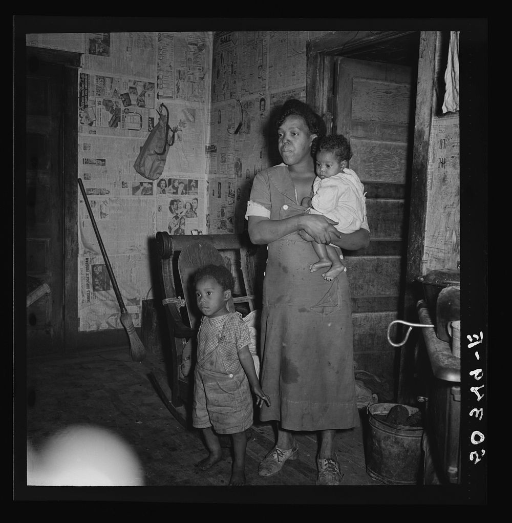 [Untitled photo, possibly related to: Coal miner's wife and two of their children. Bertha Hill, West Virginia]. Sourced from…