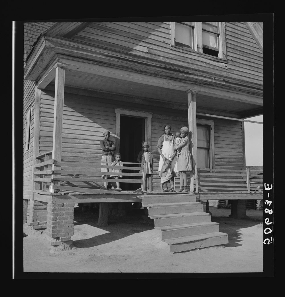  family on front porch of old home on badly eroded land near Wadesboro, North Carolina. Sourced from the Library of Congress.