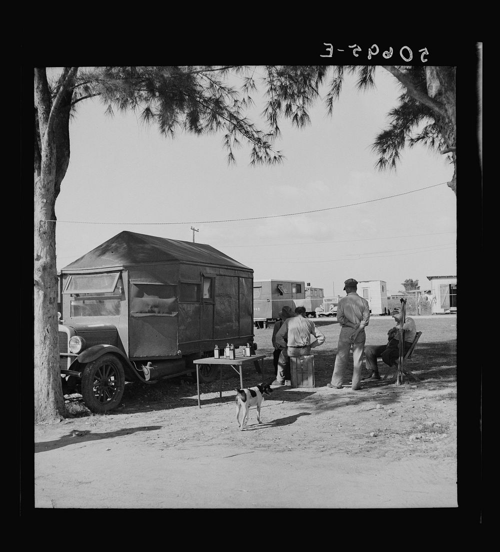 Tom Tom Herb Tonic trailertruck in transient laborer's cabin and trailer camp. Belle Glade, Florida. Sourced from the…
