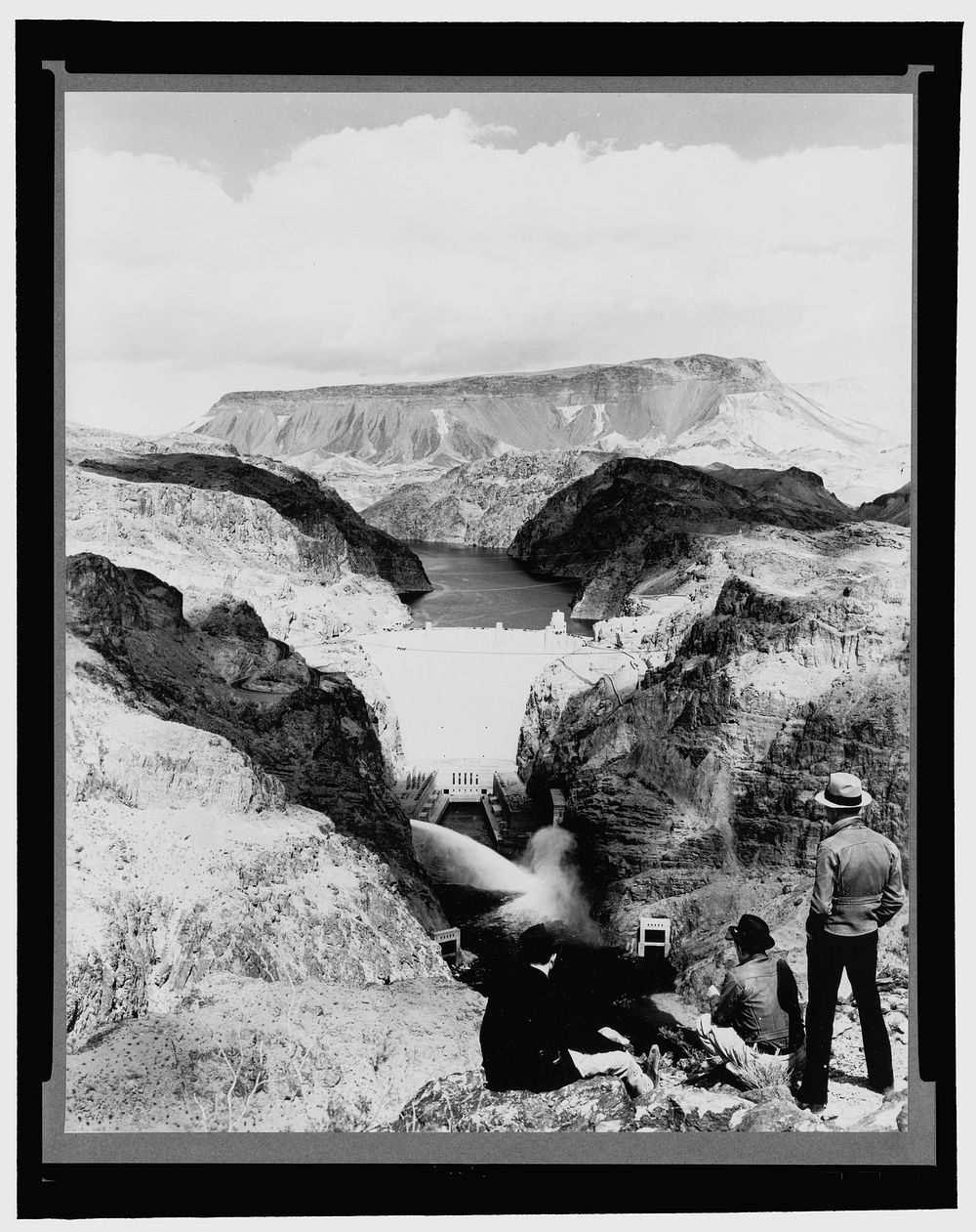 Boulder Dam, between Arizona and Nevada, Apr. 1938. Power plant discharge from two 84-inch needle valves as seen from the…