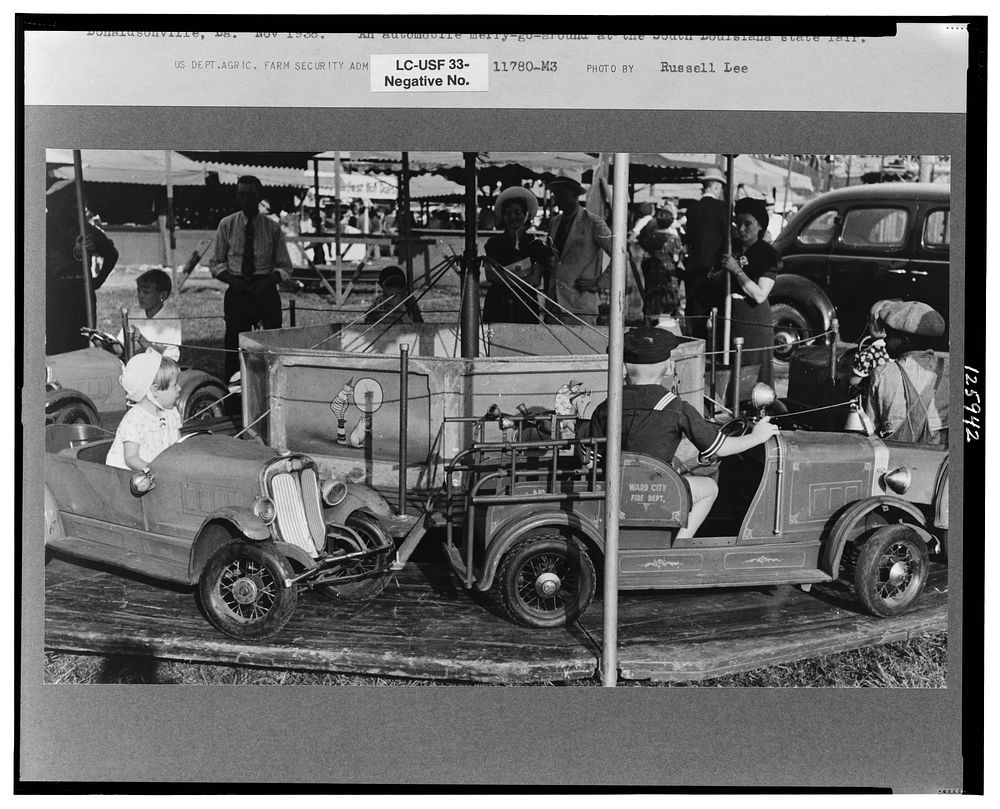 Automobile merry-go-round for the children, state fair, Donaldsonville, Louisiana by Russell Lee