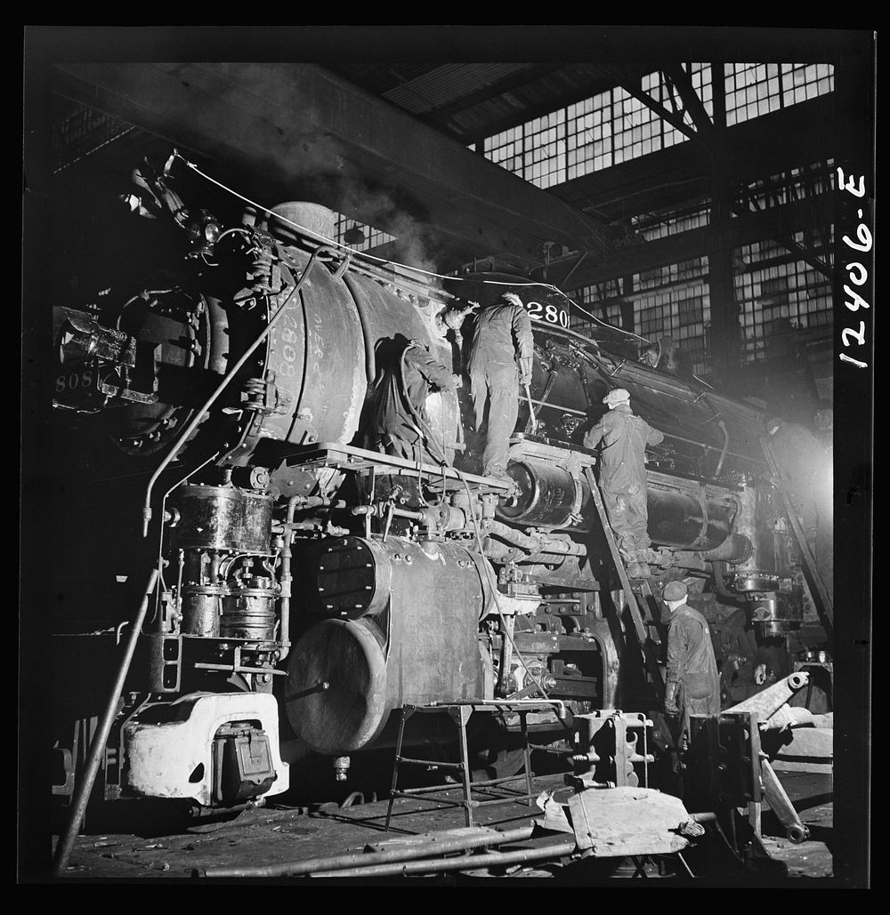 Chicago, Illinois. A locomotive of the 2800 class being repaired at the Chicago and Northwestern Railroad locomotive shops.…