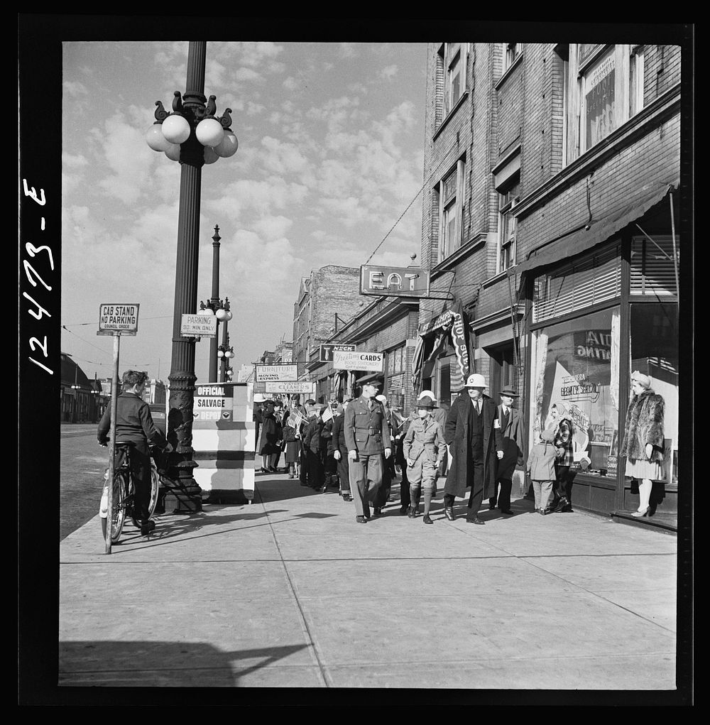 Chicago (north), Illinois. Parade, starting at Office of Civilian Defense headquarters before the dedication of a flag in…