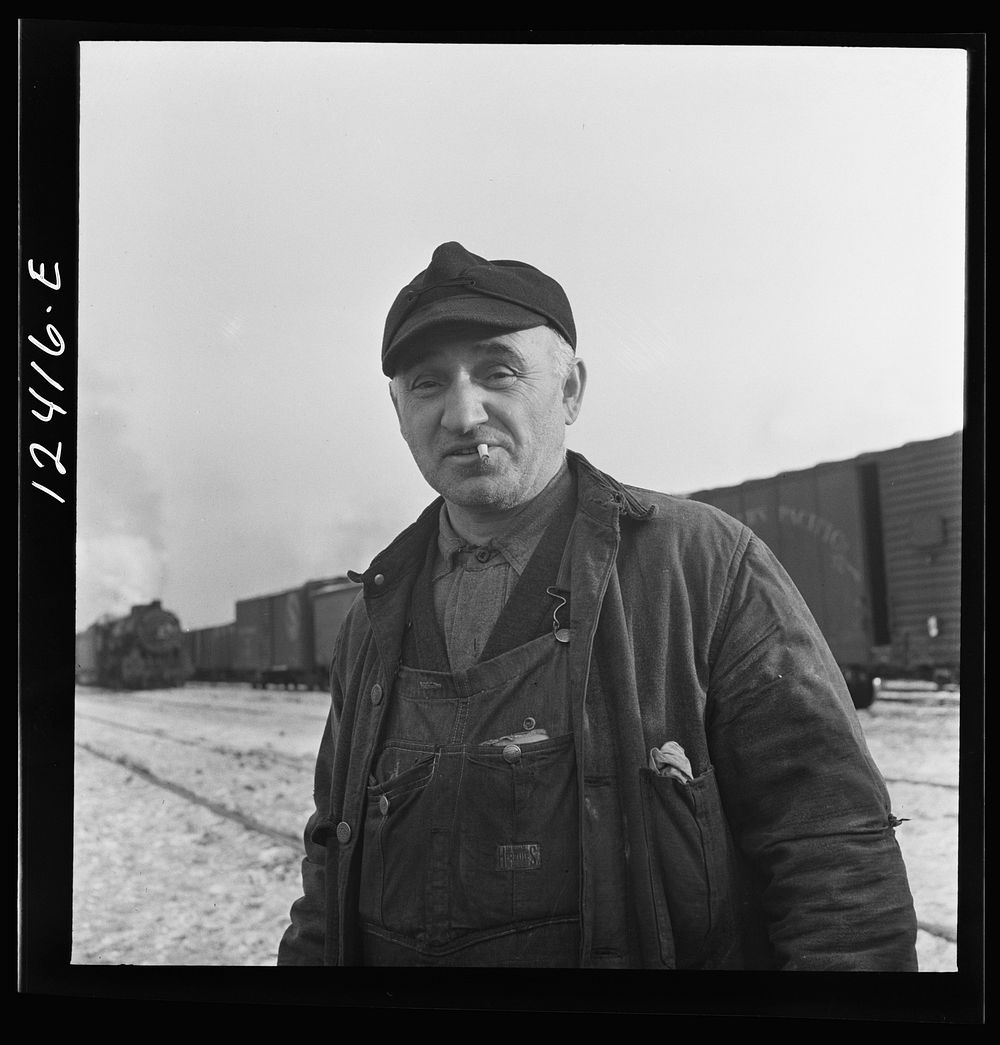 Chicago, Illinois. Railroad worker whose job is to inspect journal boxes, brake shoes, etc. and make minor repairs at a…