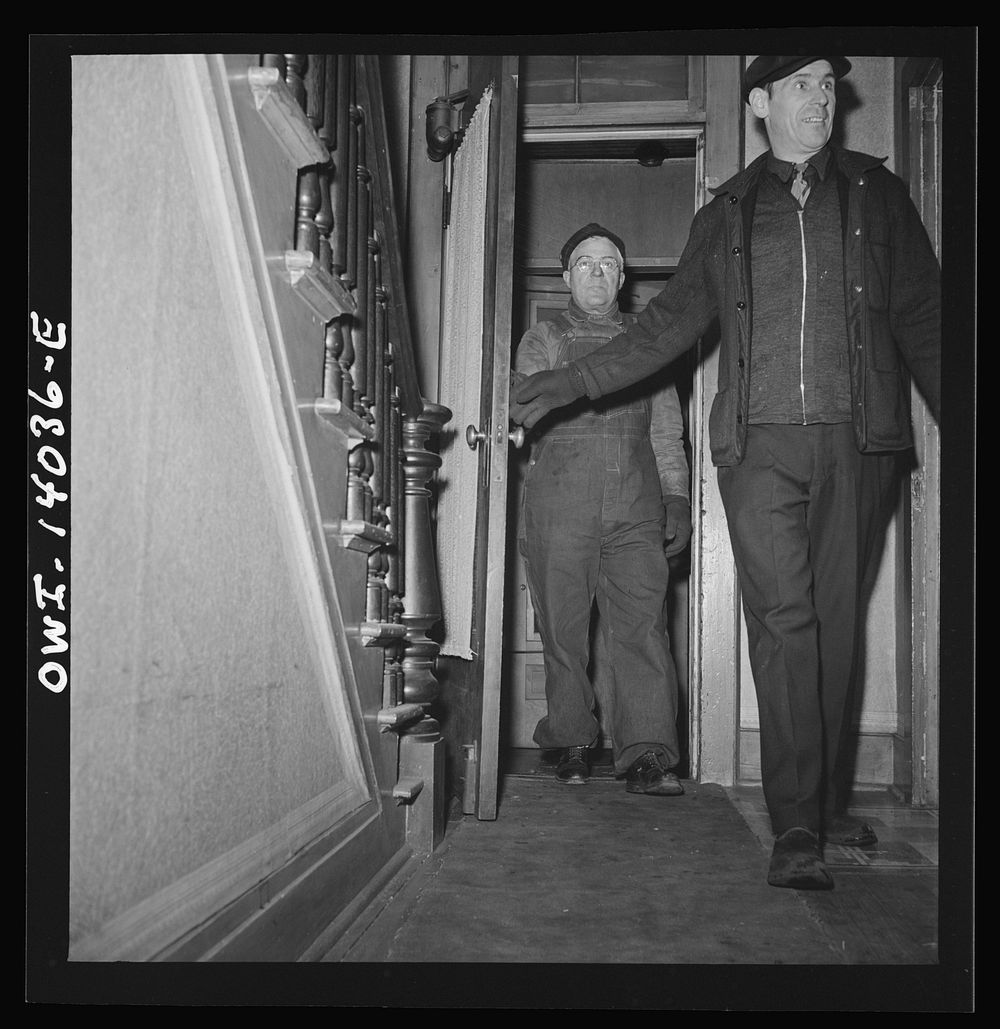 Clinton, Iowa. A train crew coming to spend the night at Mrs. Disher's, a rooming house for railroad workers. Sourced from…