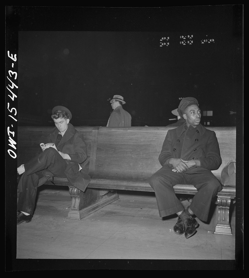 Chicago, Illinois. Sailors waiting for train in the main waiting room of the Union Station. Sourced from the Library of…