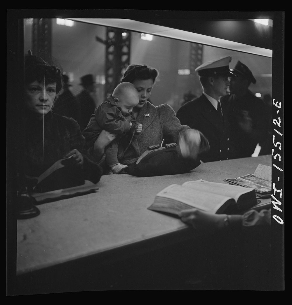 [Untitled photo, possibly related to: Chicago, Illinois. At the information booth at Union Station]. Sourced from the…