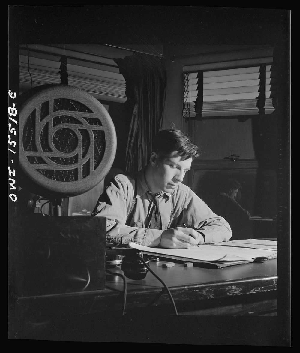 Chicago, Illinois. The secretary in the interlocking tower. He keeps a record of all the orders given and movements of…
