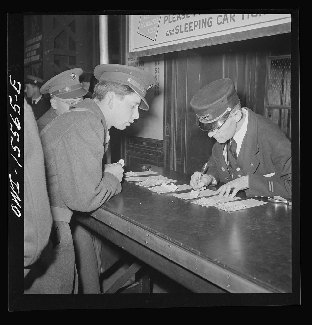 Chicago, Illinois. Soldier checking train reservation at the Union Station. Sourced from the Library of Congress.