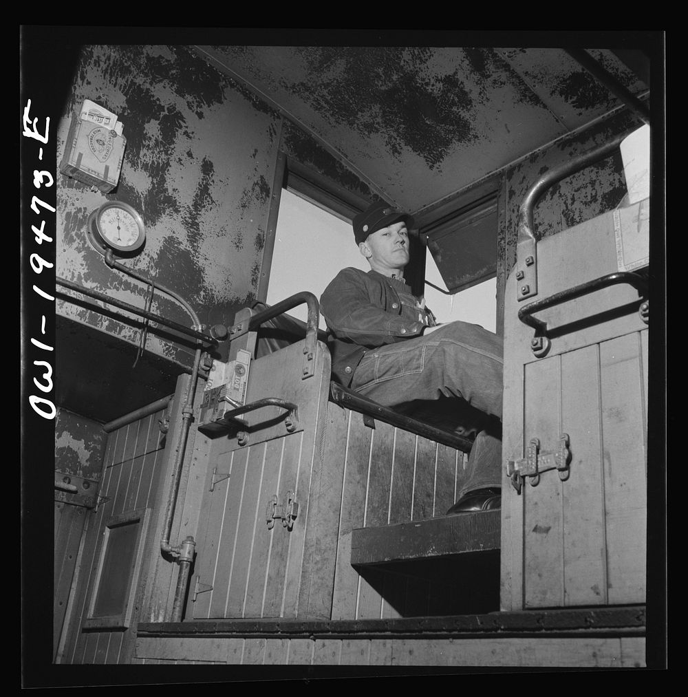 [Untitled photo, possibly related to: Walter V. Dew, rear brakeman, on the Atchison, Topeka, and Santa Fe Railroad between…