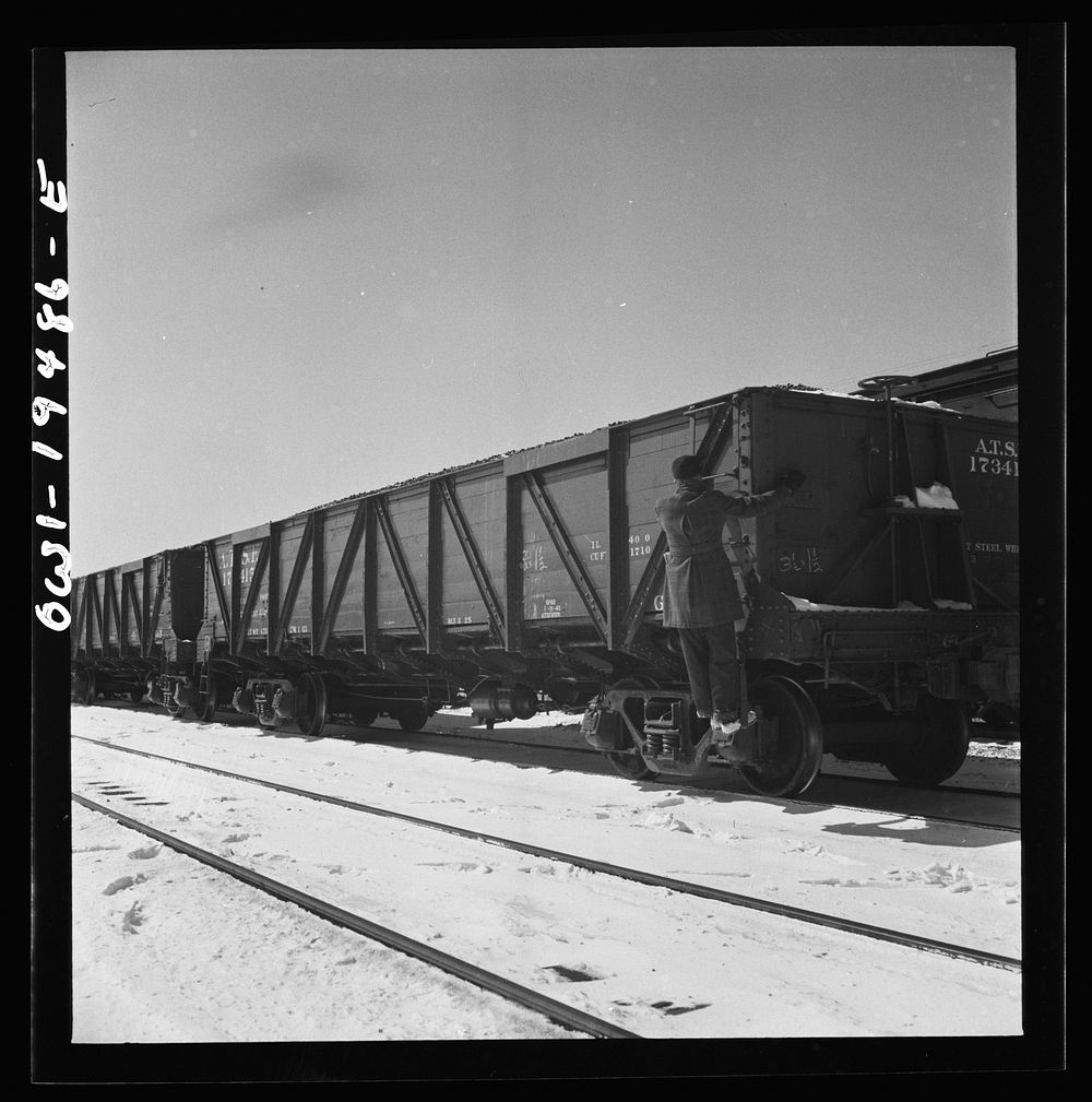 [Untitled photo, possibly related to: Joilet, Illinois. Conductor giving the brakeman the signal to apply and release the…