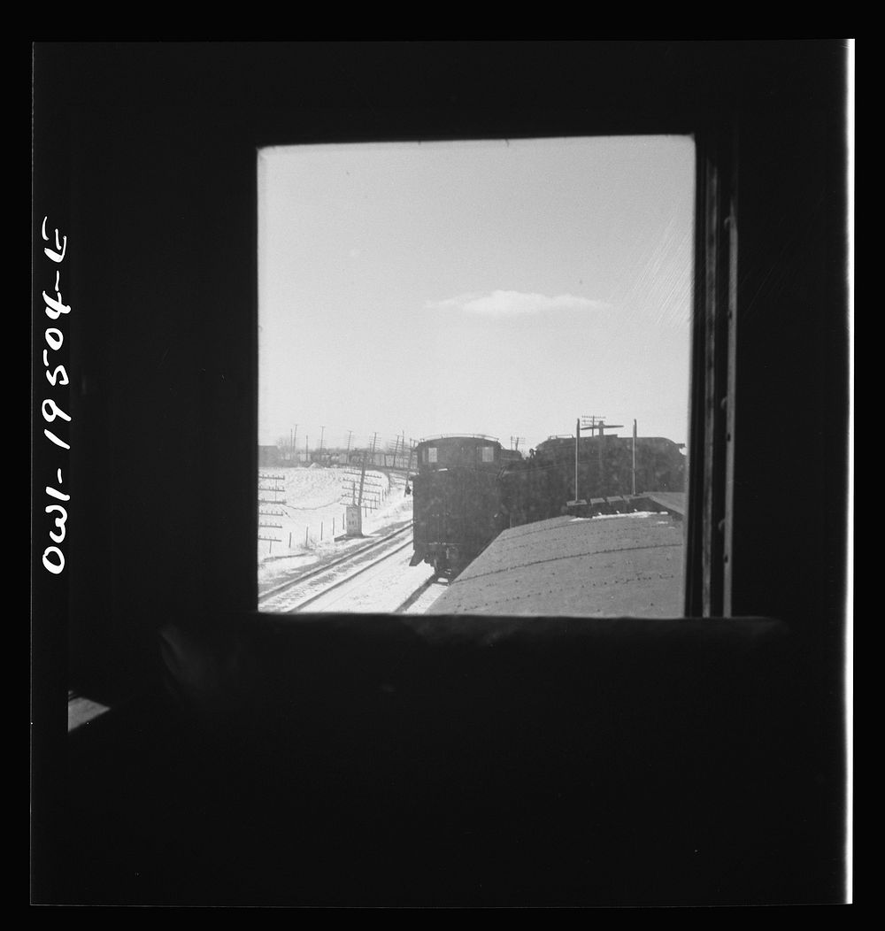 [Untitled photo, possibly related to: Streator (vicinity), Illinois. Passing an eastbound freight train on the Atchison…