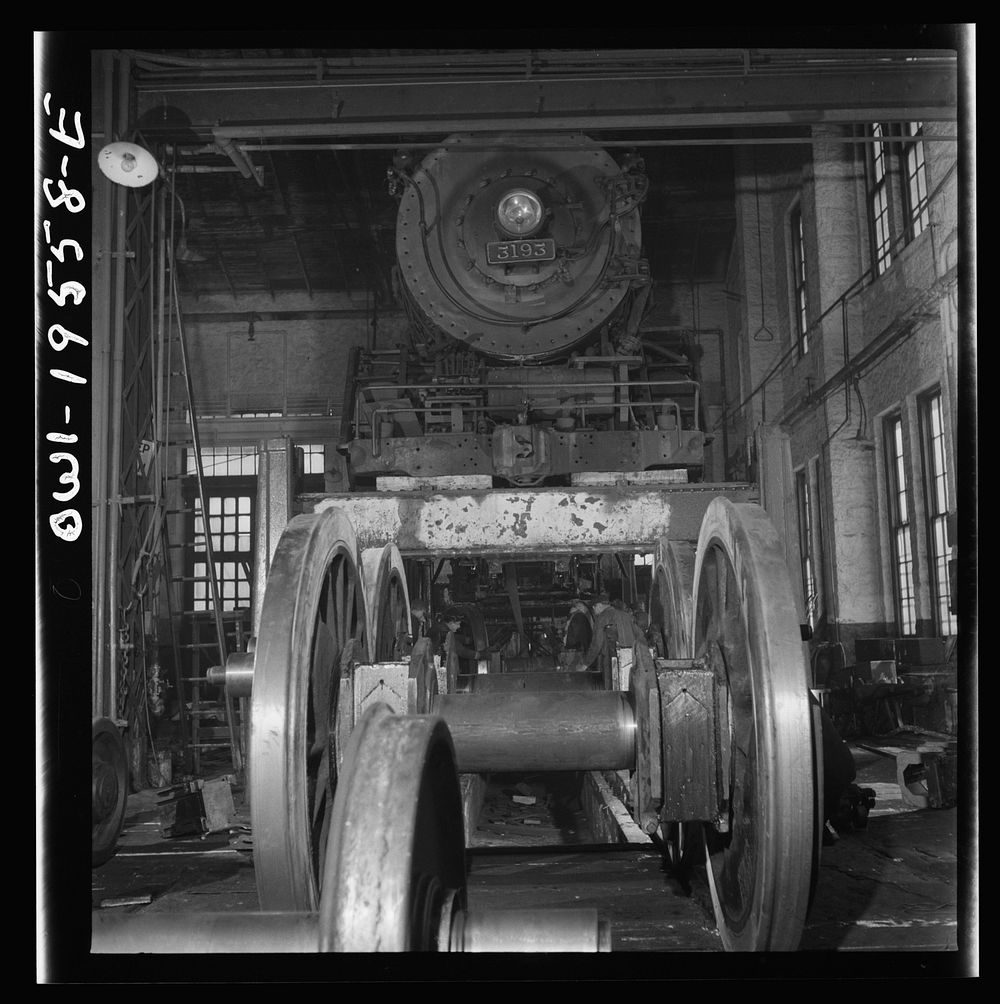 [Untitled photo, possibly related to: Fort Madison, Iowa. Wheeling and engine in the locomotive shops of the Atchison…