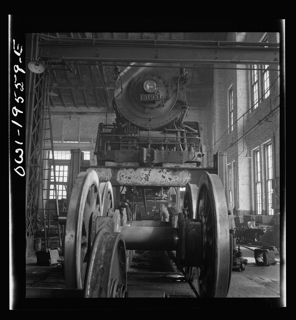 Fort Madison, Iowa. Wheeling and engine in the locomotive shops of the Atchison, Topeka, and Santa Fe Railroad. Sourced from…