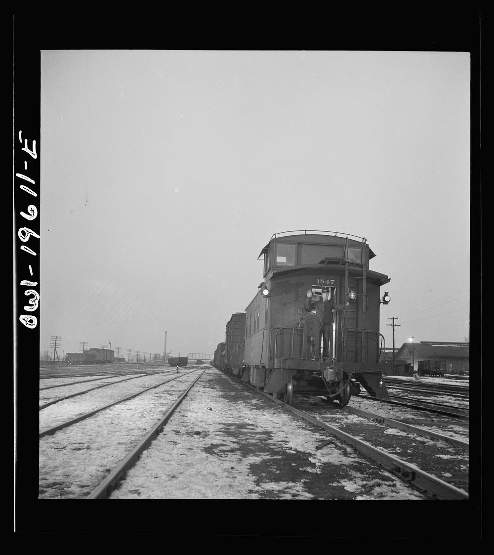 Fort Madison, Iowa. A freight train leaving the Atchison, Topeka, and Santa Fe Railroad yard for the west coast. Sourced…