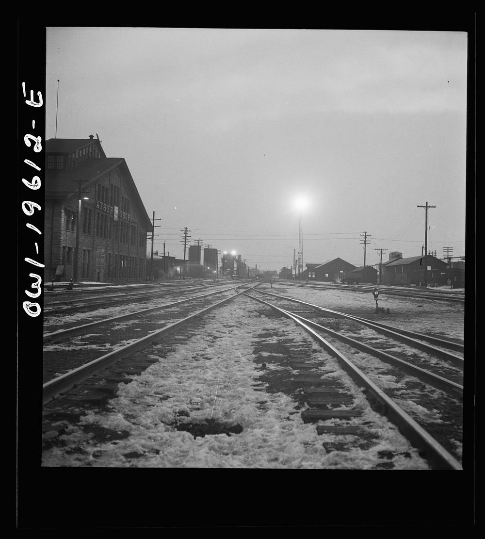 Fort Madison, Iowa. Leaving the Atchison, Topeka, and Santa Fe Railroad yard early in the morning. Sourced from the Library…
