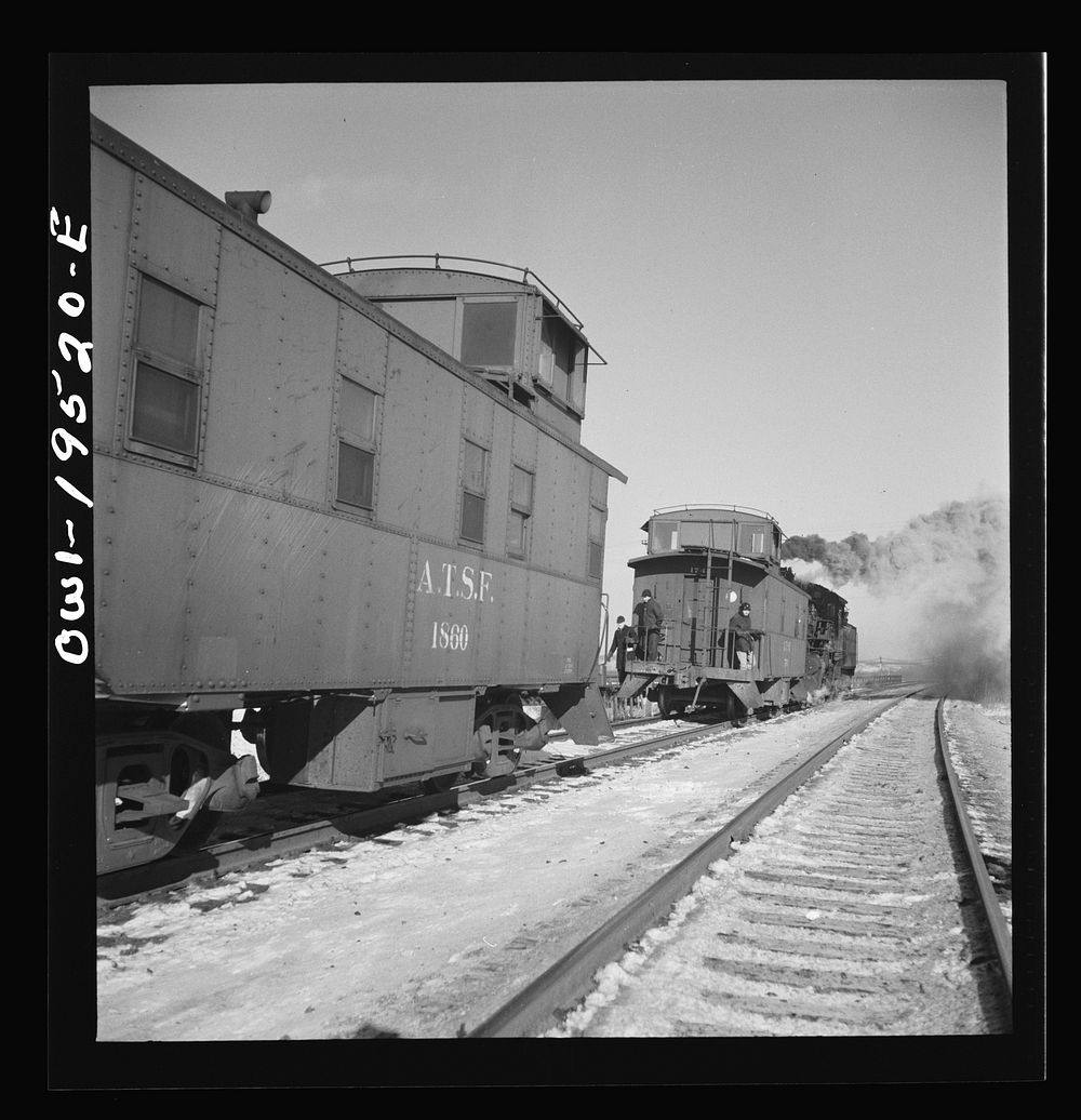 Chillicothe, Illinois. Changing crews and cabooses of a westbound freight train along the Atchison, Topeka and Santa Fe…