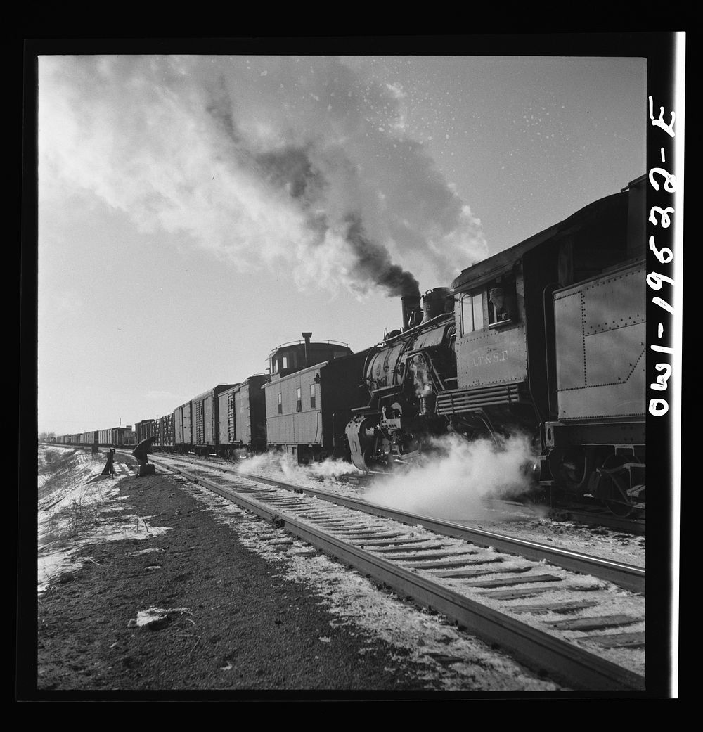 Chillicothe, Illinois. Changing crews and cabooses of a westbound freight train along the Atchison, Topeka and Santa Fe…