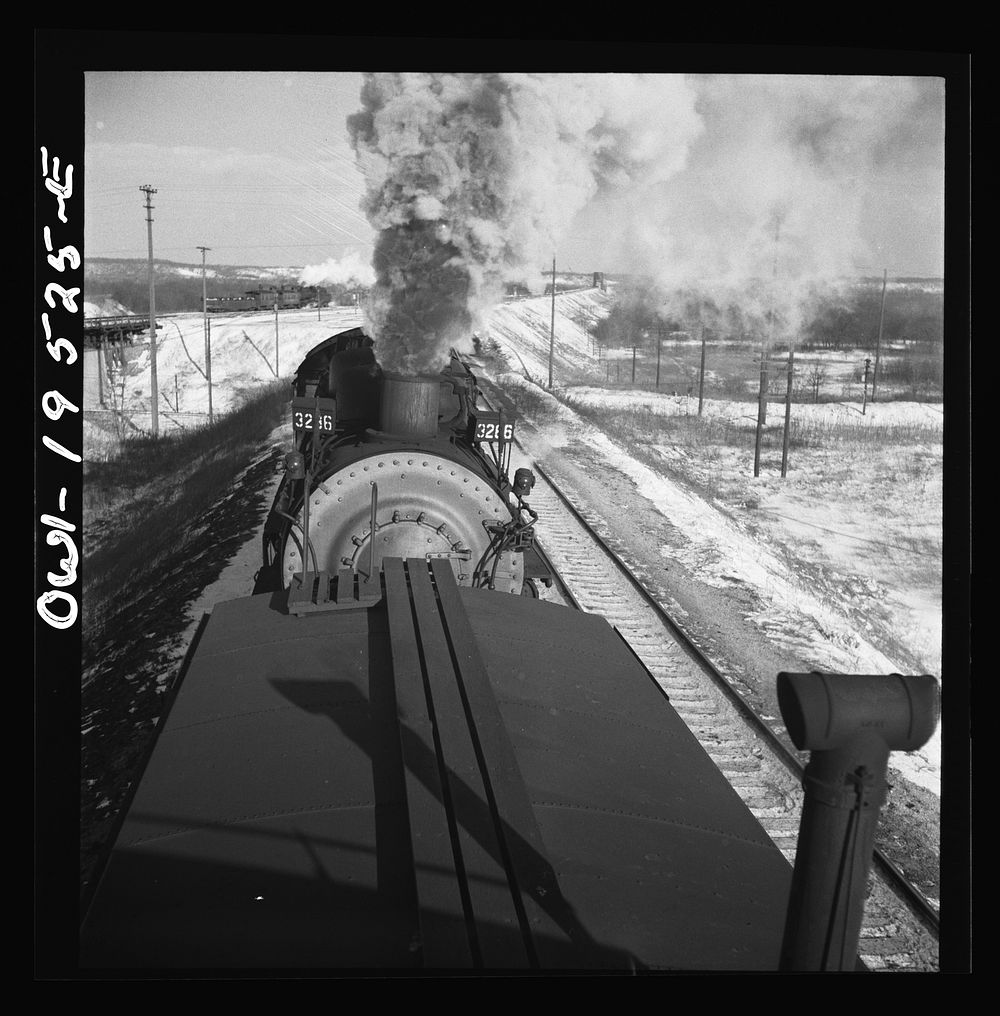 Chillicothe, Illinois. A helper engine is taken on for added power on a grade extending eight miles on the Atchison, Topeka…