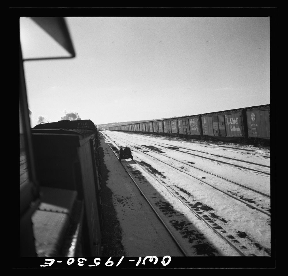 [Untitled photo, possibly related to: Streator, Illinois. Going through the Atchison, Topeka and Santa Fe Railroad yard. In…