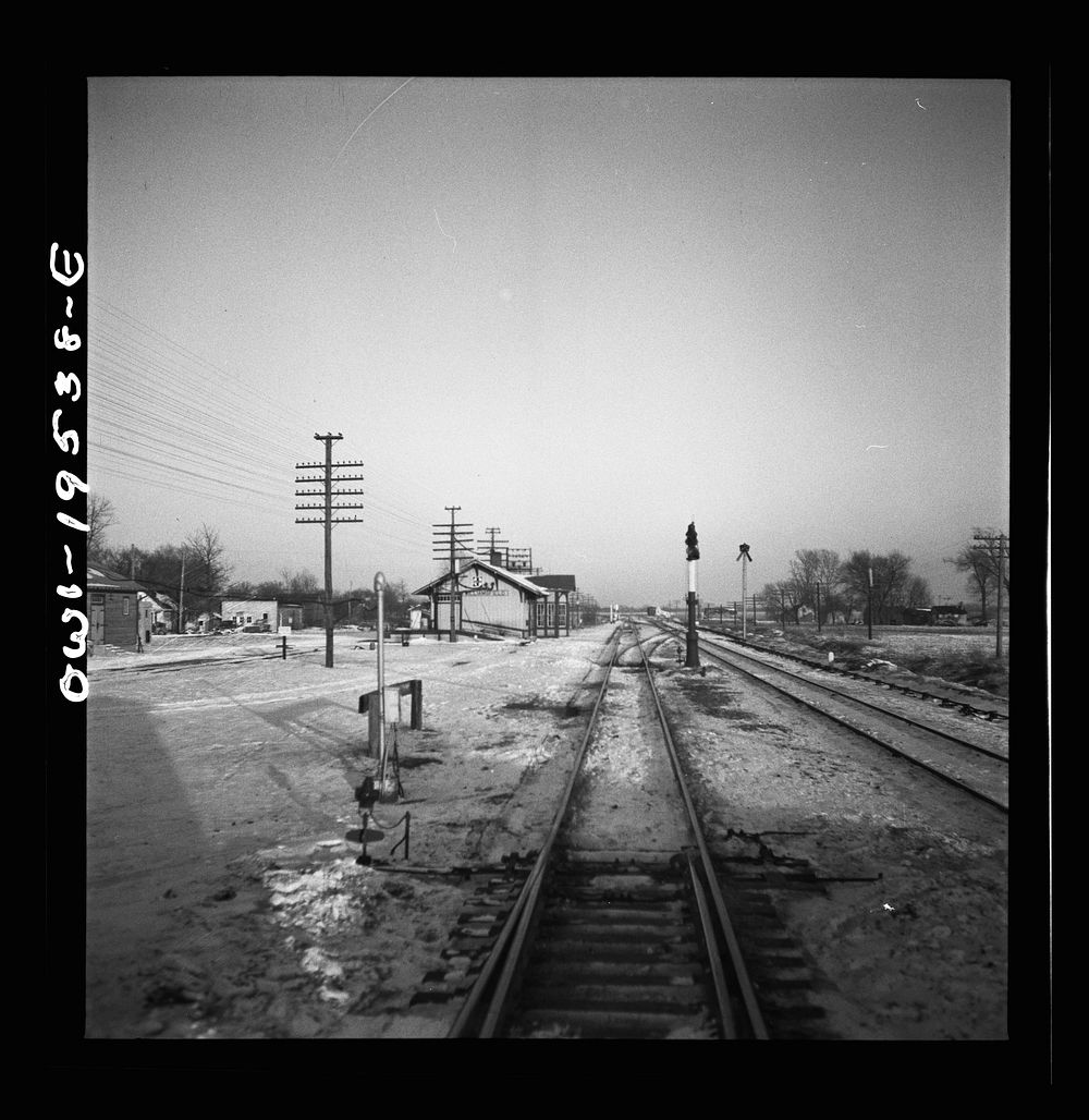 [Untitled photo, possibly related to: Ransom, Illinois. Going through the town on the Atchison, Topeka and Santa Fe Railroad…