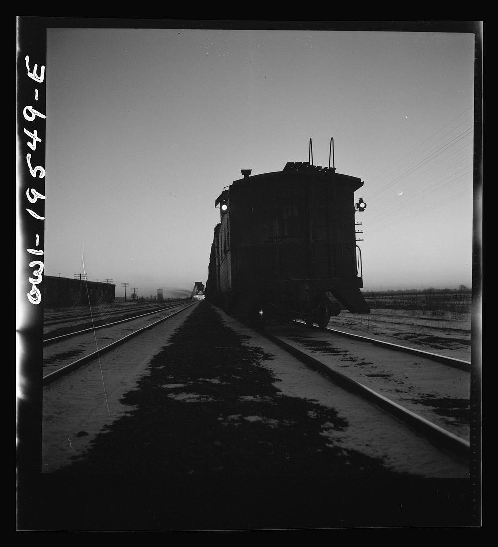 Galesburg, Illinois. A train stopping for water and coal along the Atchison, Topeka and Santa Fe Railroad between…