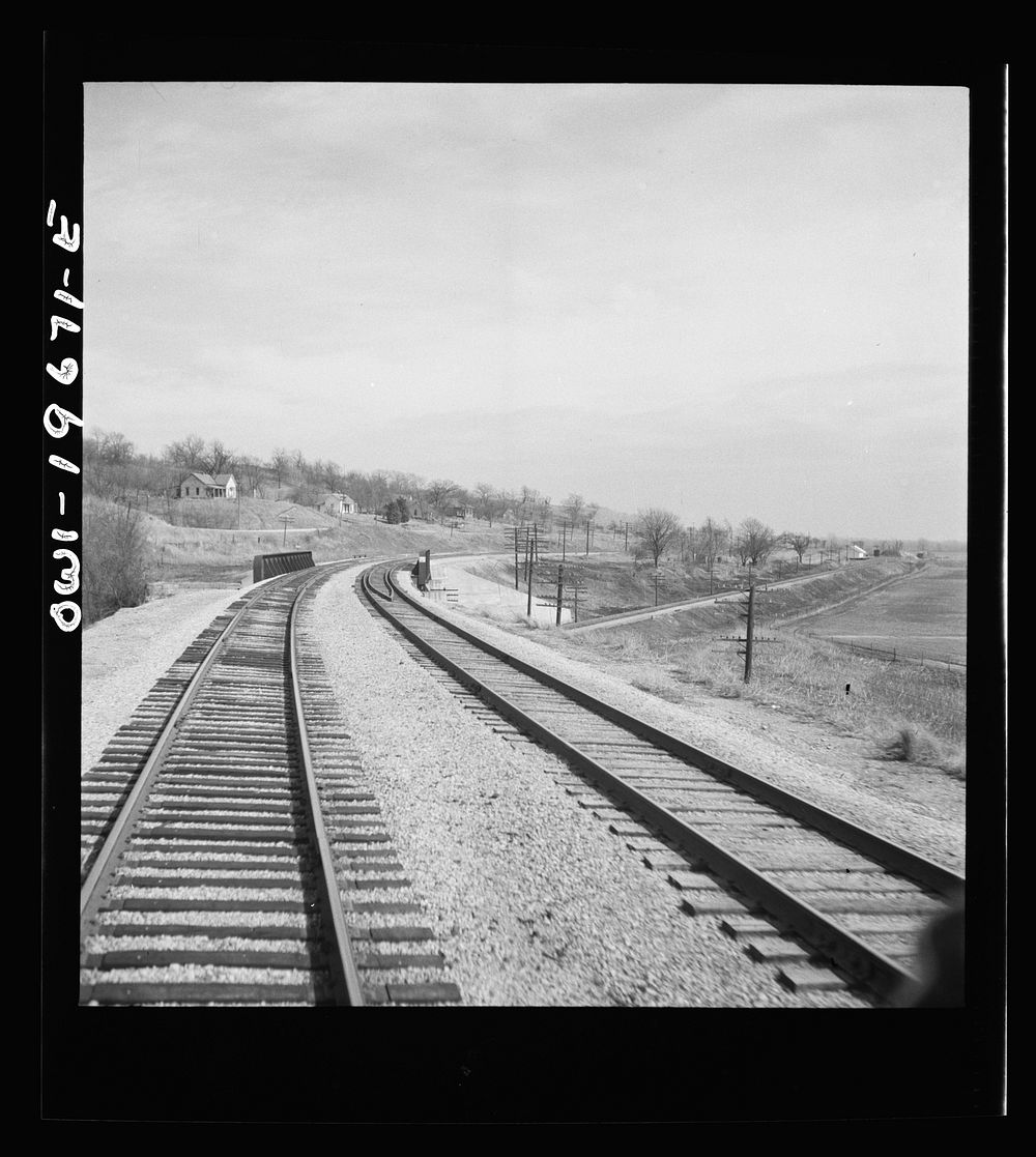 [Camden, Missouri. Looking east on the Atchison, Topeka, and Santa Fe Railroad where it crosses over the Wabash Railroad…