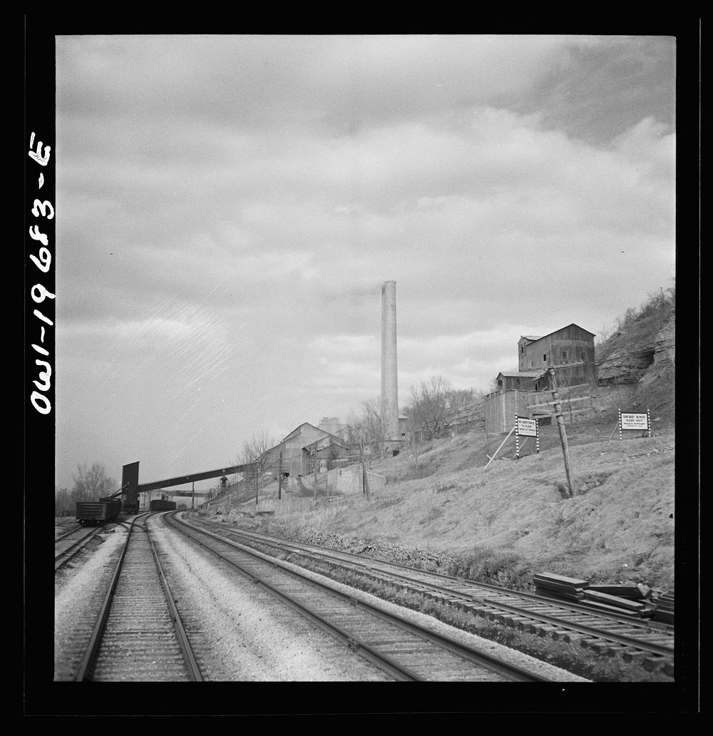 [Untitled photo, possibly related to: Cement City, Missouri. Passing a cement plant along the Atchison, Topeka, and Santa Fe…