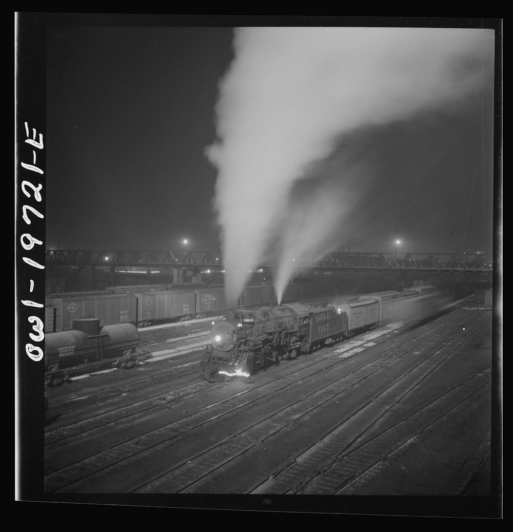 [Untitled photo, possibly related to: Argentine, Kansas. Freight train about to leave the Atchison, Topeka, and Santa Fe…