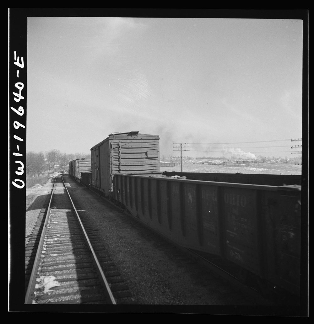 [Untitled photo, possibly related to: The crew of a passing east-bound freight train on the Atchison, Topeka, and Santa Fe…