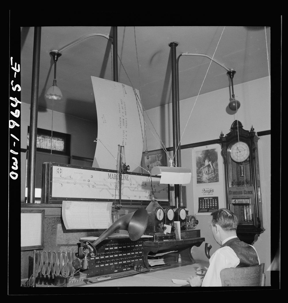 Marceline, Missouri. A dispatcher at work in the Atchison, Topeka, and Santa Fe Railroad offices. Sourced from the Library…