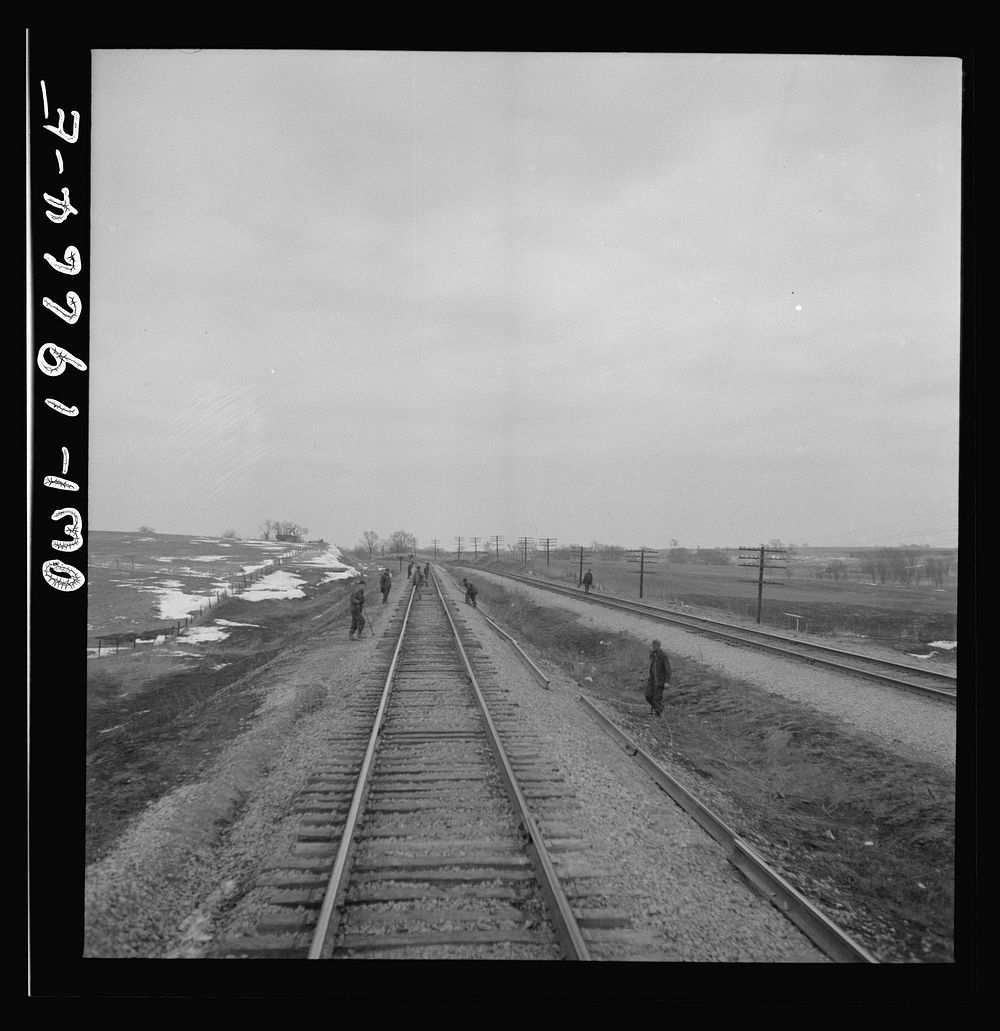 Carrollton (vicinity), Missouri. A section gang at work along the Atchison, Topeka, and Santa Fe Railroad between Marceline…