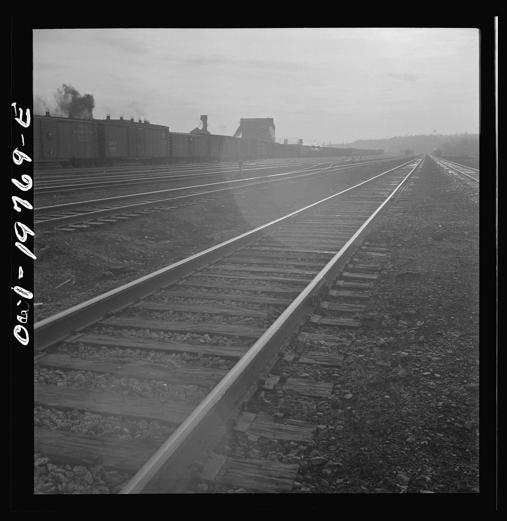 [Untitled photo, possibly related to: Argentine, Kansas. An Atchison, Topeka, and Santa Fe train pulling out of the railroad…