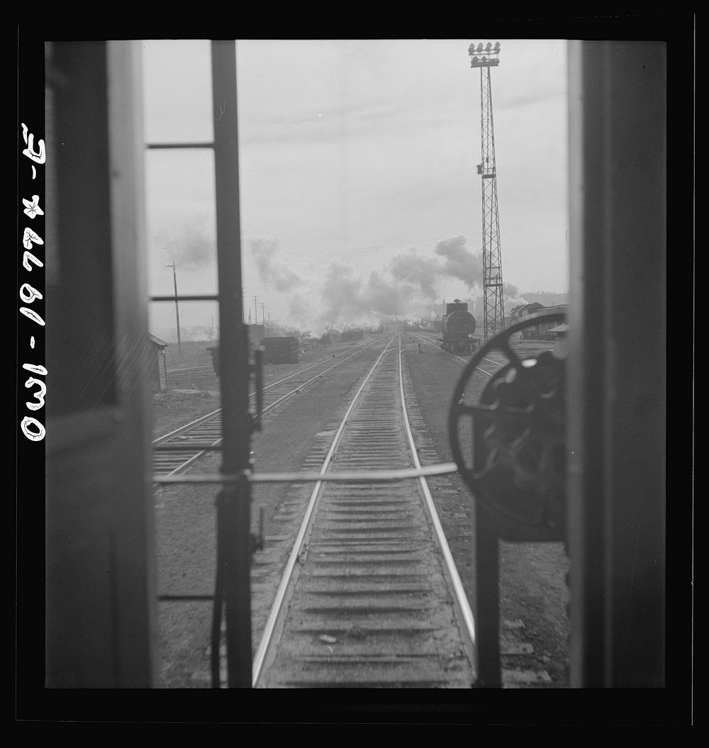[Untitled photo, possibly related to: Argentine, Kansas. Atchison, Topeka, and Santa Fe Railroad train pulling out of the…
