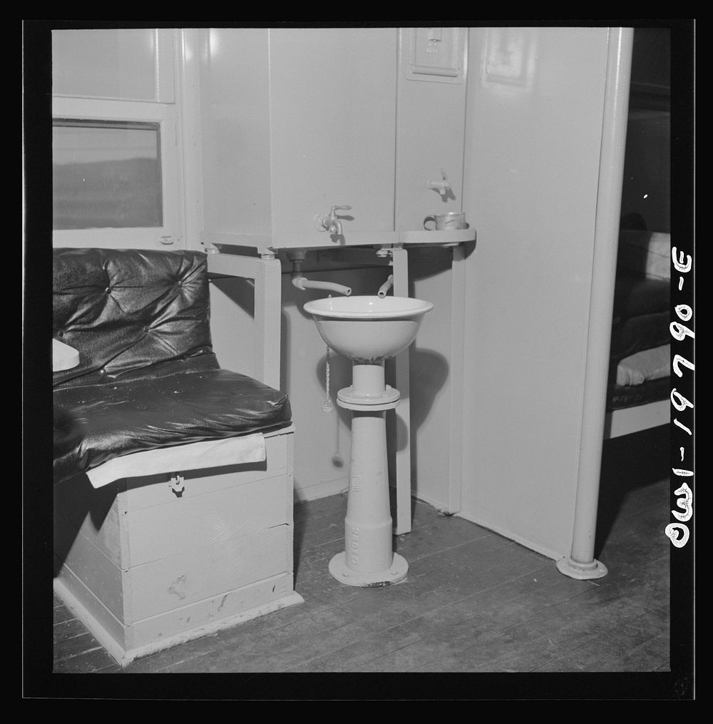 Washbasin in a caboose on the Atchison, Topeka, and Santa Fe Railroad between Argentine and Emporia, Kansas. Spigot on the…