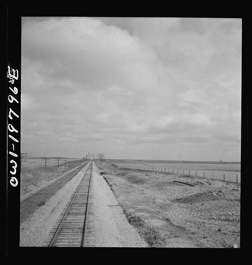 Emporia (vicinity), Kansas. Crossing farm land along the Atchison, Topeka, and Santa Fe Railroad. Sourced from the Library…
