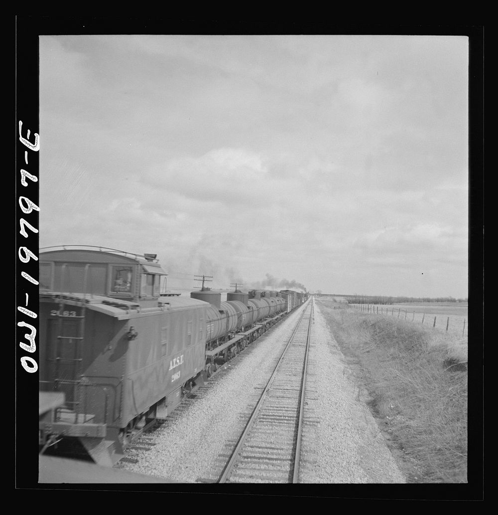 [Untitled photo, possibly related to: Emporia, Kansas. An Atchison, Topeka, and Santa Fe train between Argentine and…