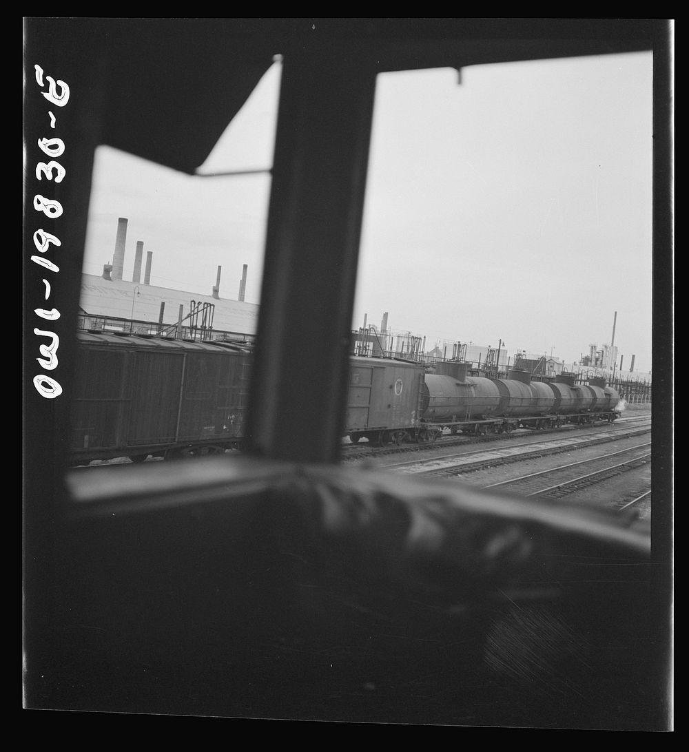 [Untitled photo, possibly related to: Wellington, Kansas. An oil refinery seen through the windows of the cupola of the…