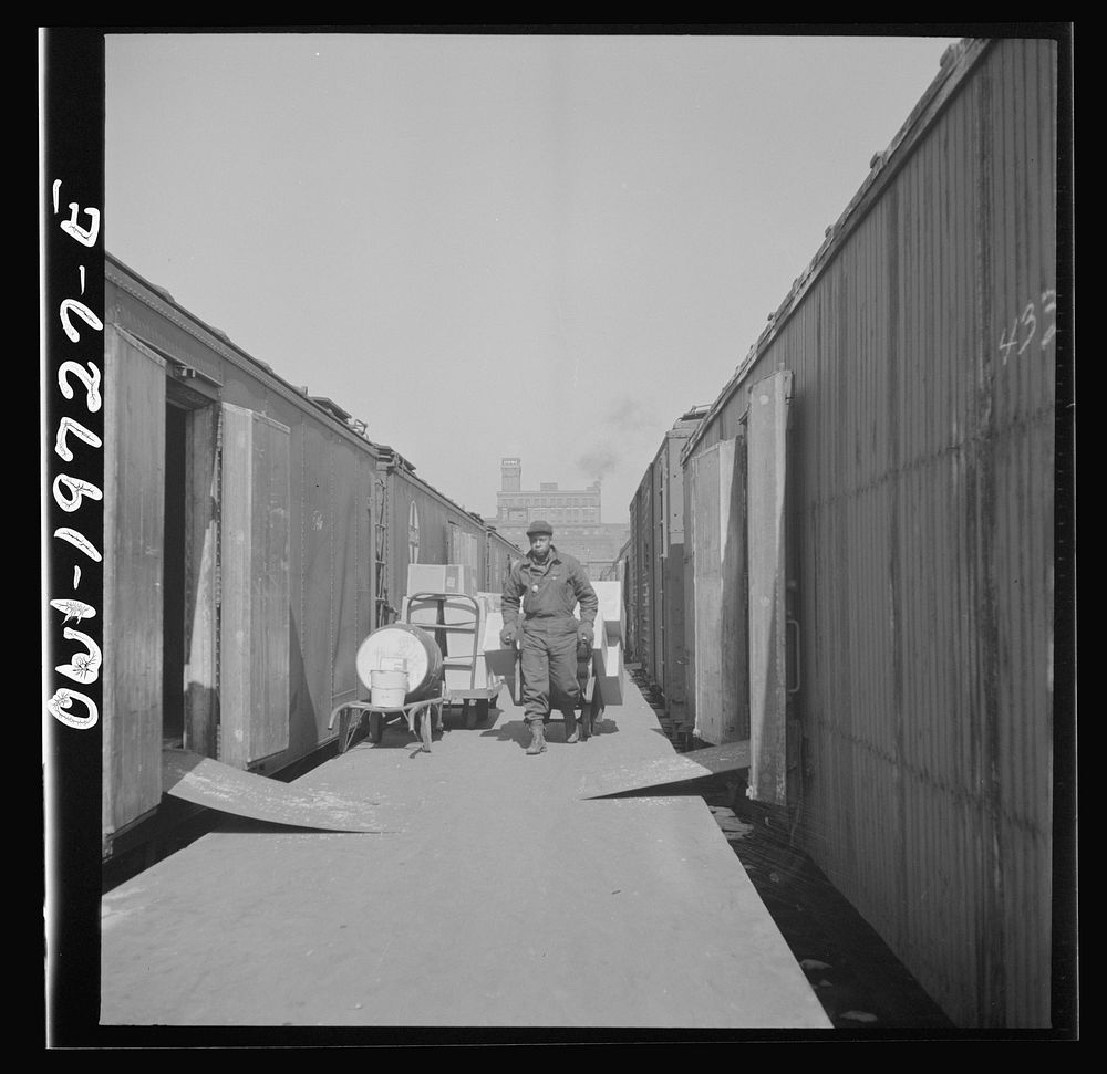 [Untitled photo, possibly related to: Kansas City, Missouri. Loading and unloading cars at the Atchison, Topeka, and Santa…
