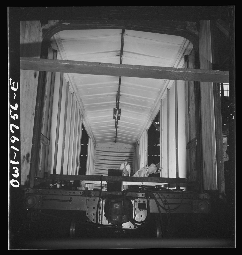 [Untitled photo, possibly related to: Topeka, Kansas. Working on a special car for the transportation of airplane wings in…