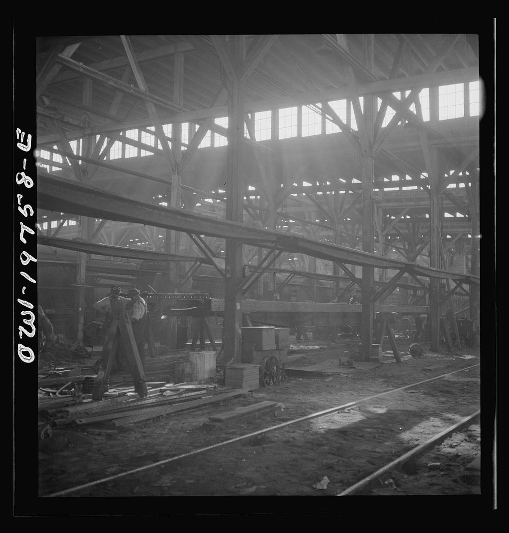Topeka, Kansas. In the shops of the Atchison, Topeka and Santa Fe Railroad, cars are completely stripped and rebuilt from…