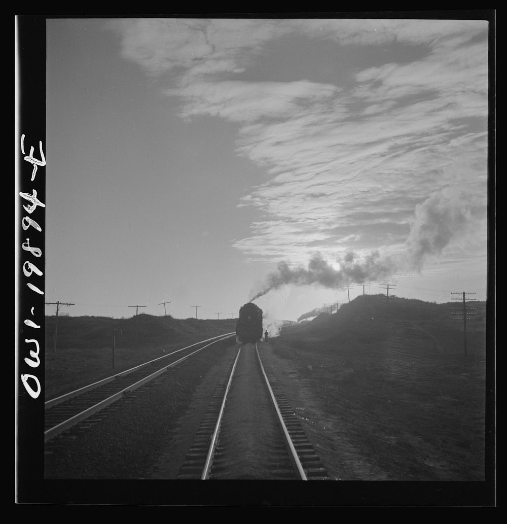 Curtis, Oklahoma. Helper engine leaving the train on Atchison, Topeka, and Santa Fe Railroad. Sourced from the Library of…