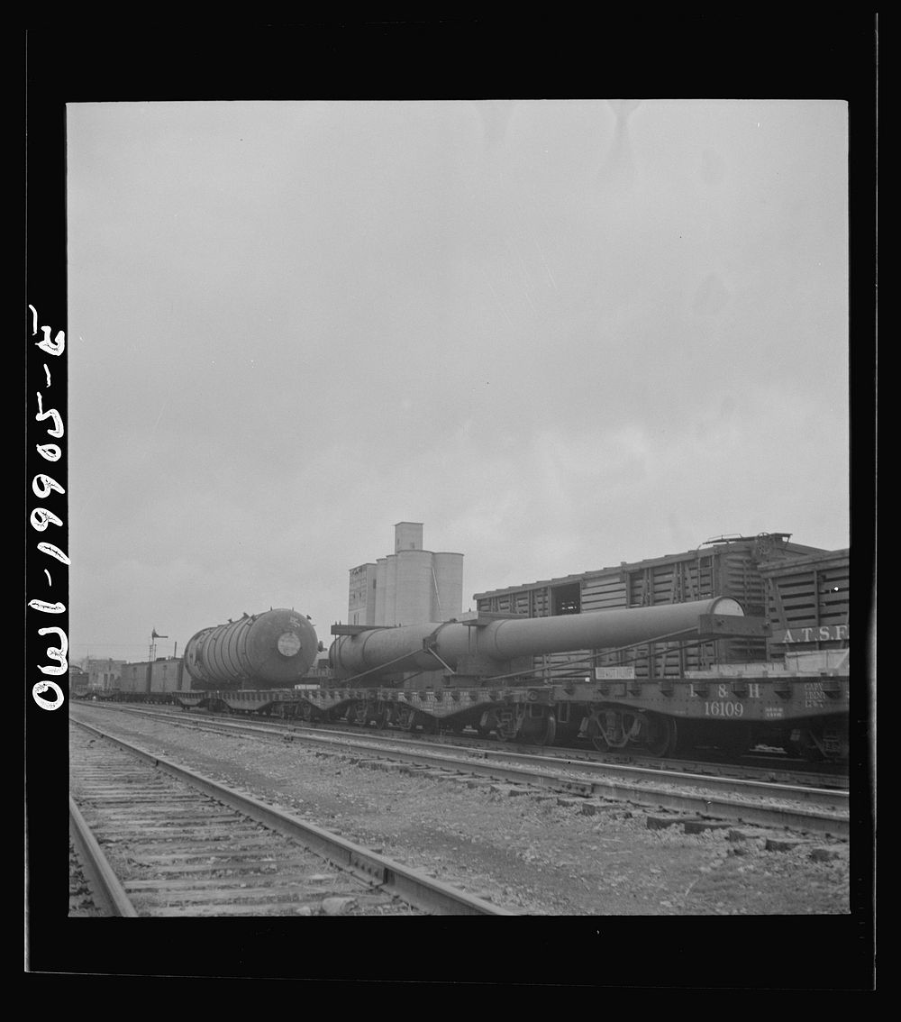 Wellington, Kansas. A huge naval gun bound for the West coast in the Atchison, Topeka and Santa Fe Railroad yard. Sourced…