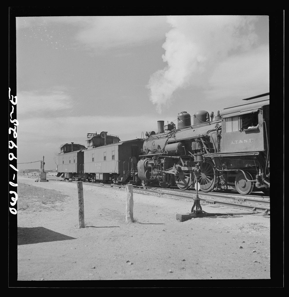 Canadian, Texas. Switch engine changing cabooses on a Atchison, Topeka and Santa Fe Railroad train. Sourced from the Library…