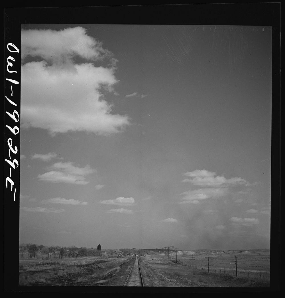 [Untitled photo, possibly related to: Miami, Texas. Train stopping for water along the Atchison, Topeka, and Santa Fe…