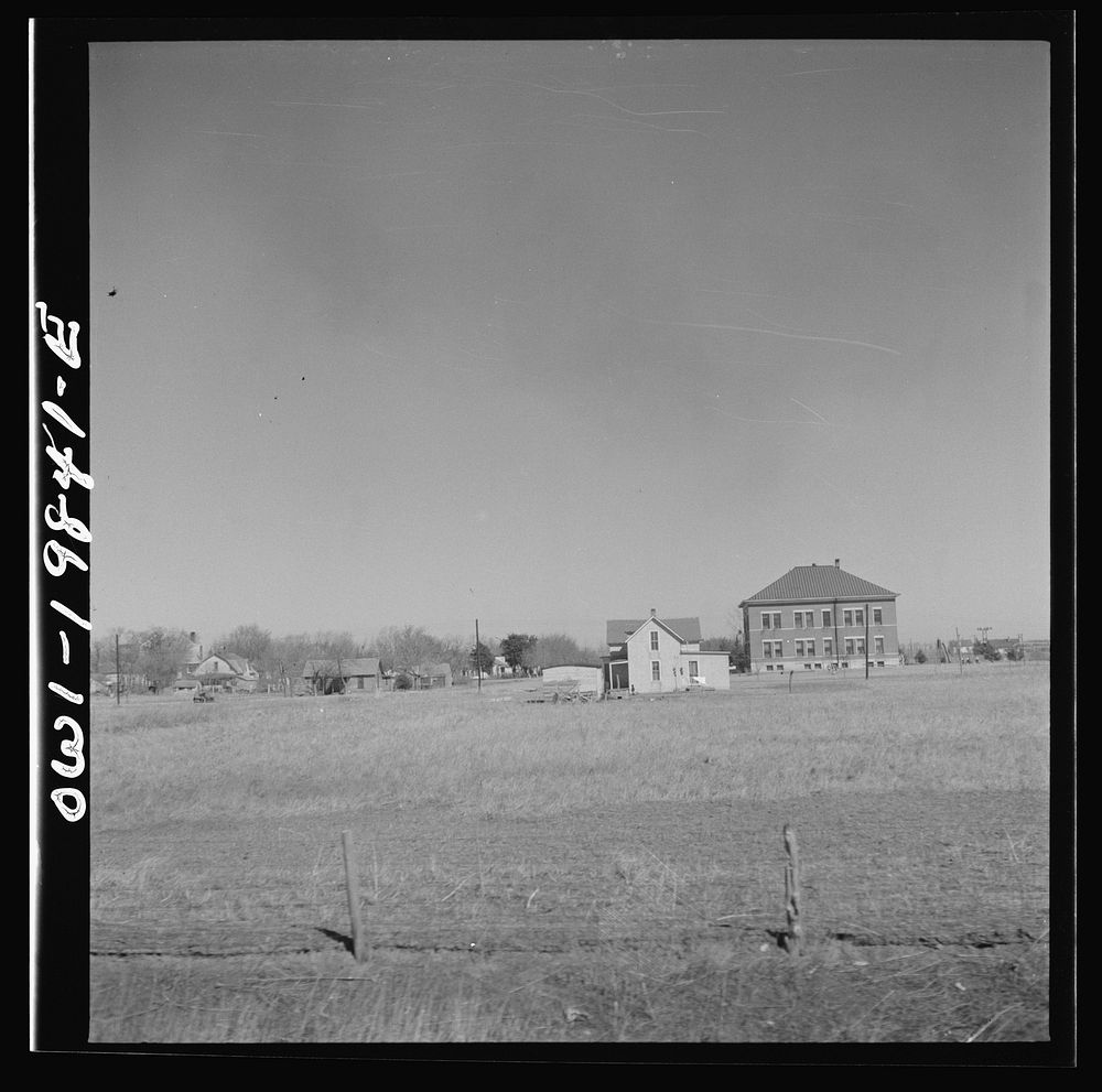 Argonis, Kansas. A schoolhouse and part of the town on the Atchison, Topeka and Santa Fe Railroad between Wellington, Kansas…