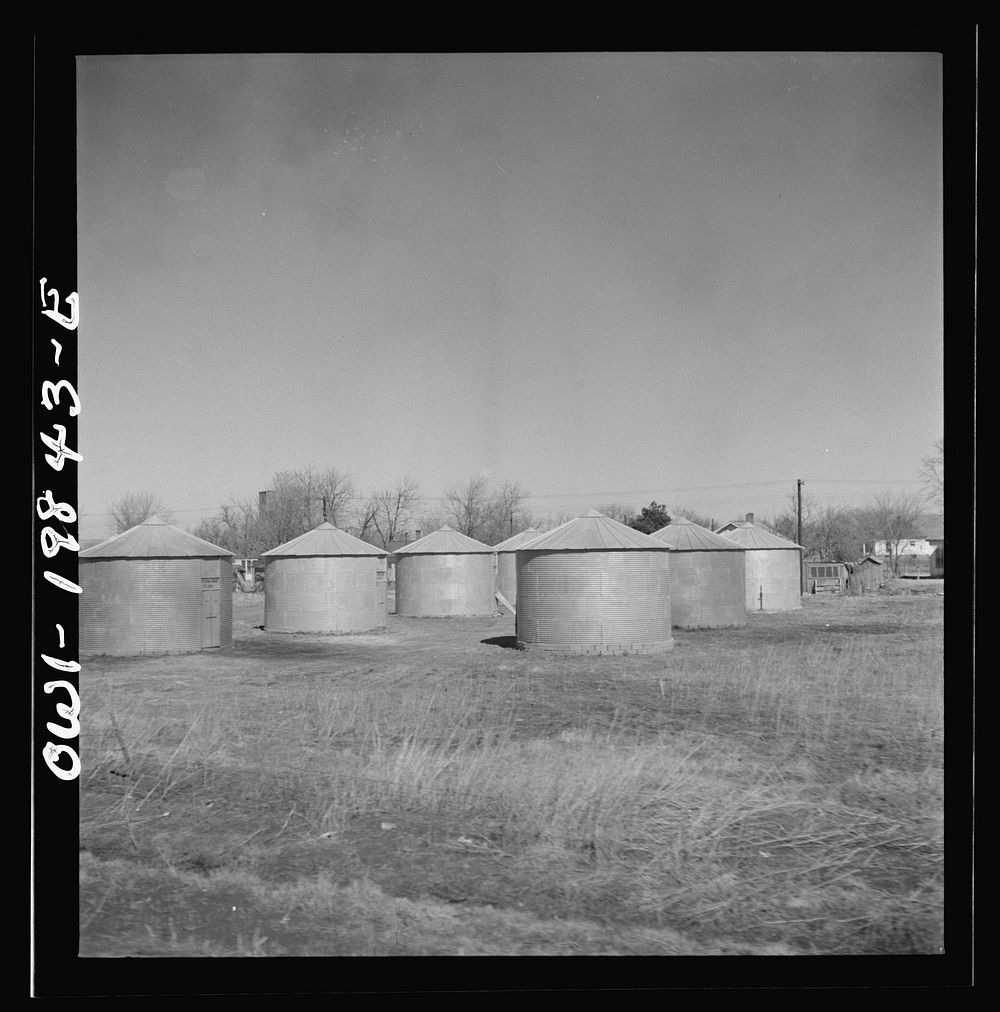 Argonis, Kansas. Wheat storage bins on the Atchison, Topeka and Santa Fe Railroad between Wellington, Kansas and Waynoka…