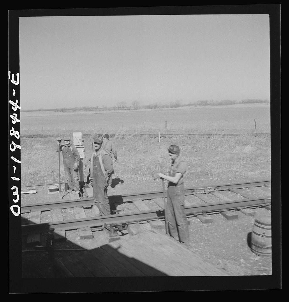 [Untitled photo, possibly related to: Carrollton (vicinity), Missouri. A section gang at work along the Atchison, Topeka…