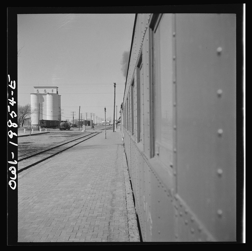 [Untitled photo, possibly related to: Kiowa, Kansas. Train waiting for a block signal along the Atchison, Topeka and Santa…