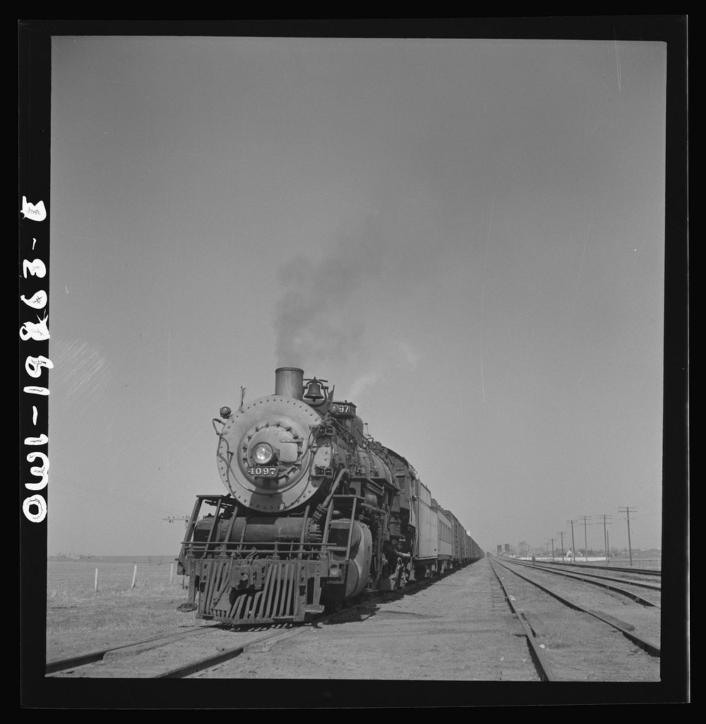 Kiowa, Kansas. Freight train pulling out on the Atchison, Topeka and Santa Fe Railroad between Wellington, Kansas and…
